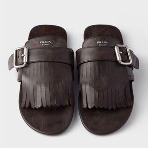 prada tobacco capretto sandals Heels Heel strap with metal buckle Enameled metal triangle logo Leather sole with lettering logo Leather Leather These are shoes I have